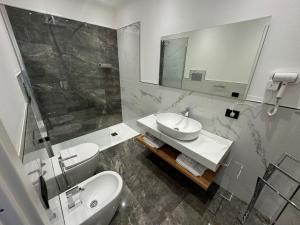Koupelna v ubytování GRA' Suite Deluxe