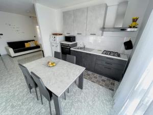 Kuchyň nebo kuchyňský kout v ubytování Apulian Apartment