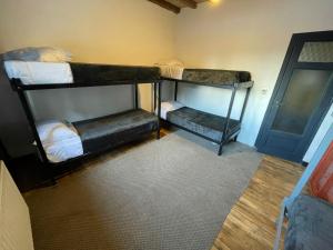 Postel nebo postele na pokoji v ubytování Hostel Punto Patagónico Bariloche