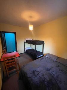 Postel nebo postele na pokoji v ubytování Hostel Punto Patagónico Bariloche
