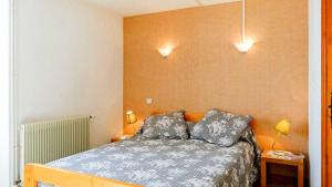 Postel nebo postele na pokoji v ubytování Gites de france 4 personnes au fau de peyre