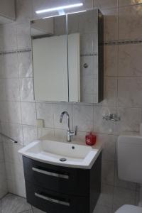 Koupelna v ubytování Kiebitzstieg 22, Nr5