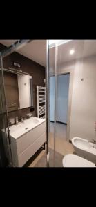 a bathroom with a white sink and a toilet at Casa Edera in Monterosso al Mare +22 photos