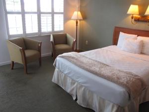a hotel room with two beds and two lamps at Blue Marlin Motel in Key West
