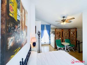 a bedroom with a bed and a table and chairs at La Finca in Oropesa del Mar