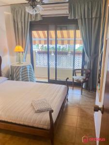 a bedroom with a bed and a window at La Finca in Oropesa del Mar