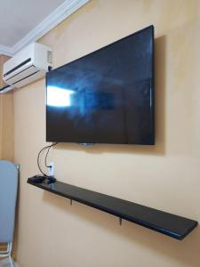 TV a/nebo společenská místnost v ubytování Casa de temporada + 16 fotografií