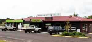 two trucks parked in front of a grocery store at Manjimup Gateway Hotel in Manjimup