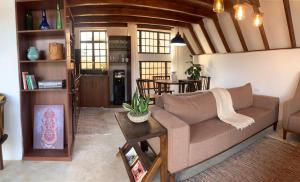 a living room with a couch and a table at Sereno Cabana in Arusha