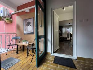 a mirror in a room with a table and a chair at Istria Symphony Apartment in Labin