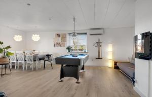 a living room with a ping pong table in it at Stunning Home In Havndal With Wifi in Havndal
