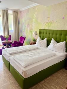 Postel nebo postele na pokoji v ubytování Hotel Allmer