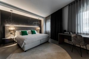 Postel nebo postele na pokoji v ubytování Hotel Doriguzzi