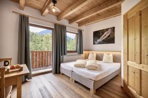 Postel nebo postele na pokoji v ubytování AREA 47 - Tirol