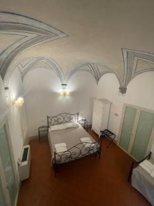 Postel nebo postele na pokoji v ubytování BonConvento Guesthouse - HiTuscany