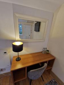 TV a/nebo společenská místnost v ubytování The Nu Place Suite + 6 fotografií