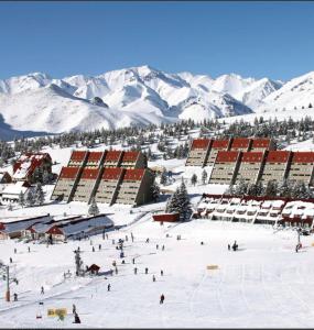 a group of people on a ski slope in the snow at Mi Rincon in San Rafael +19 photos