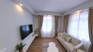 TV a/nebo společenská místnost v ubytování Machico Heart Suites