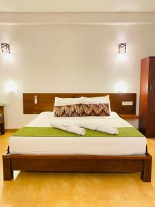 Postel nebo postele na pokoji v ubytování Tropicara Resort