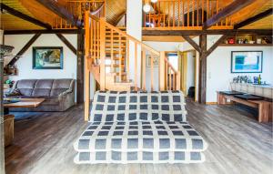 a living room with a couch and a table at 2 Bedroom Cozy Apartment In Otterndorf in Otterndorf