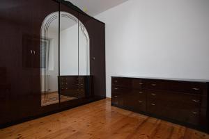 a room with a dresser and a large mirror at Apartments Bells of Ljubljana - 3 cosy apartment Private Free Parking in Ljubljana