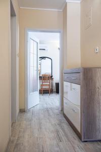 an open door to a dining room with a table at Apartments Bells of Ljubljana - 3 cosy apartment Private Free Parking in Ljubljana +56 photos
