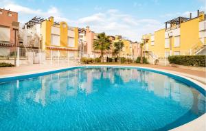 a large swimming pool in front of some buildings at Charming Apartment With Pool in Vera +17 photos