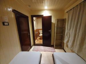 a room with a bathroom with a toilet and a door at Moon Boat in Luxor +7 photos