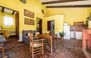 a living room with a table and a couch at Lovely Home In Cazalla De La Sierra in Cazalla de la Sierra