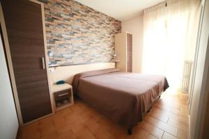 Postel nebo postele na pokoji v ubytování Hotel Velus