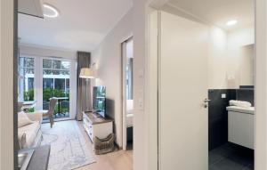 a room with a kitchen and a living room at Baltischer Hof Apartment 20 in Boltenhagen