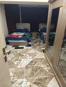 A bed or beds in a room at شقه مفروشه