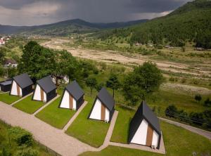 an overhead view of a group of tents in a field at Reconnect Glamping Stulpicani in Stulpicani