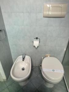 a bathroom with a toilet and a bidet at Lovelyloft Navigli - Gelsomino in Milan +6 photos