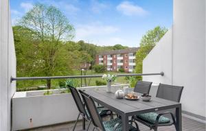 a table and chairs on a balcony with a view at Apartment Marienlyst 06 in Helsingør