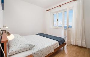 Postel nebo postele na pokoji v ubytování Holiday Home Starigrad Kod Senja, Obala Cr