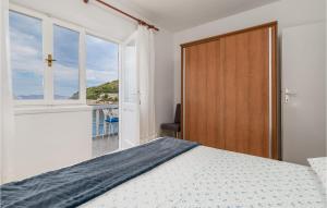 Postel nebo postele na pokoji v ubytování Holiday Home Starigrad Kod Senja, Obala Cr