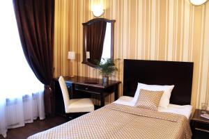 Llit o llits en una habitació de Hotel Business Apartments