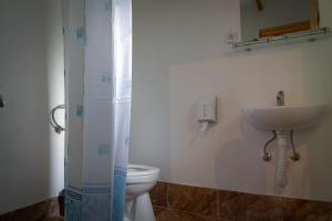 a bathroom with a sink and a toilet at Rafting Camp Tara Center Tri Vodenice in Bastasi +67 photos