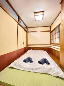 Postel nebo postele na pokoji v ubytování 上野公园日式民宿