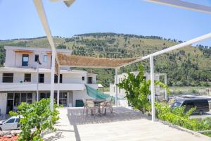 a view of a house with a patio at Cereni Guesthouse in Berat