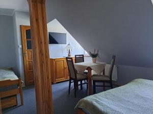 Postel nebo postele na pokoji v ubytování Dom Gościnny