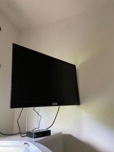 TV a/nebo společenská místnost v ubytování Hotel Prestige