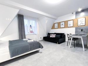 Katil atau katil-katil dalam bilik di Apartamenty Margaret +18 gambar
