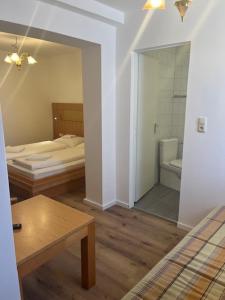 Postel nebo postele na pokoji v ubytování City Hotel Post 14