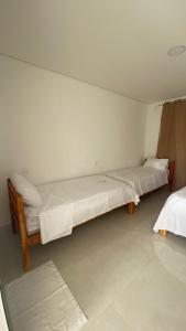 Postel nebo postele na pokoji v ubytování Hotel Capivara