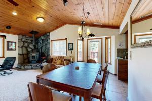 a dining room with a table and a fireplace at Northwoods Paradise in Truckee