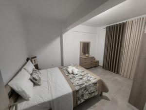 Ένα ή περισσότερα κρεβάτια σε δωμάτιο στο Irina's Apartment