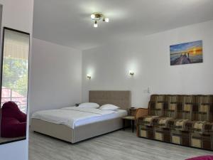 Postel nebo postele na pokoji v ubytování Vila Octopus