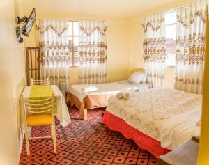 Postel nebo postele na pokoji v ubytování Hotel Summita
